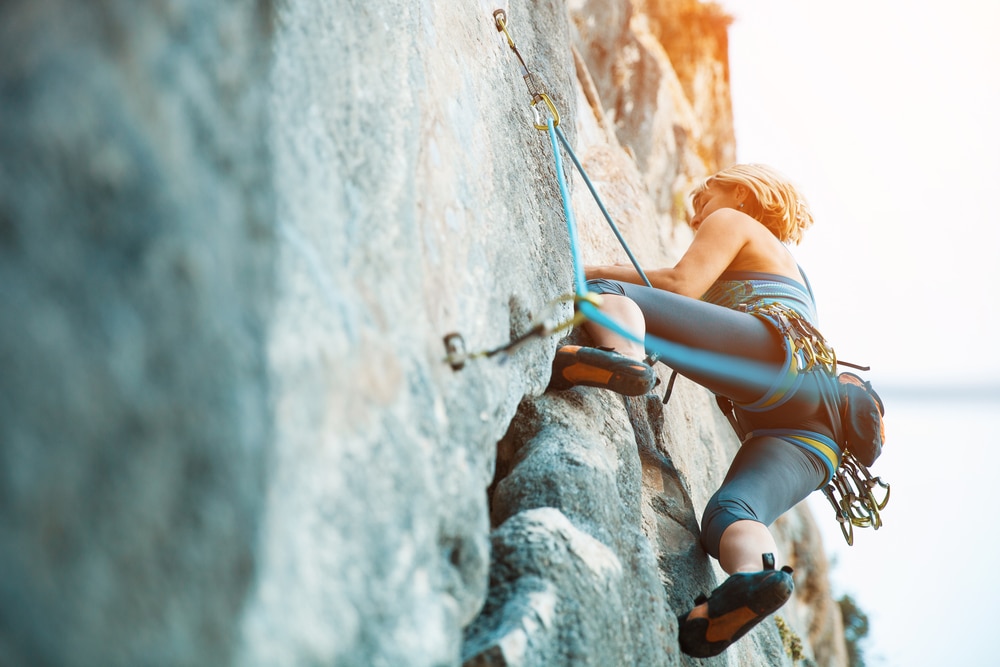 Photo of a rock climber at Devil's Lake State Park near our Baraboo Bed and Breakfast