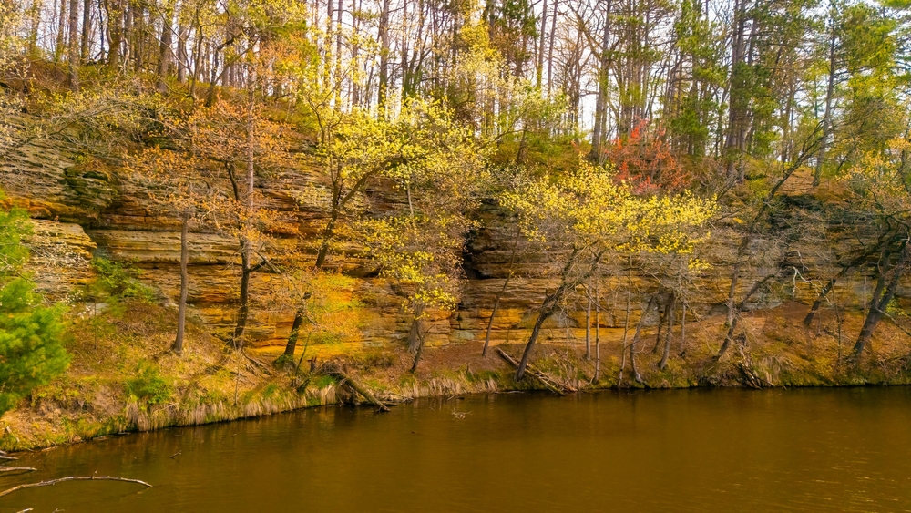 View of Mirror Lake State Park and sandstone cliffs in Wisconsin in the fall.